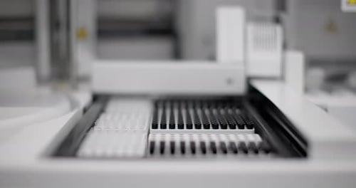 Close Up of Test Tubes in Lab Machine