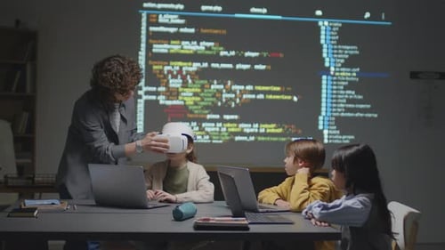 Teacher Showing Children Virtual Reality Headset in Class