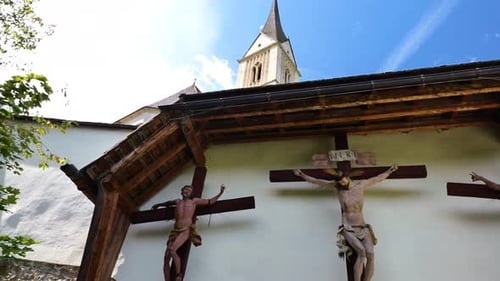 Jesus Christ and two martyrs crucifixion on wooden crosses in the Church of St. Leonard