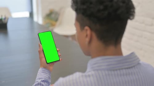 African Woman Using Green Screen Smartphone