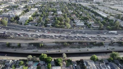 Aerial view across busy traffic cars driving congestion on Hollywood 101 freeway interchange
