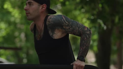 Man Doing Dips Outside in Park