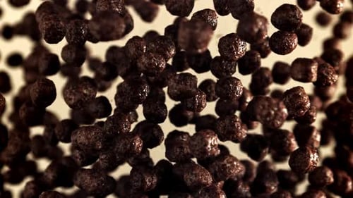 Chocolate Cereal Puffs Floating, Dark Background