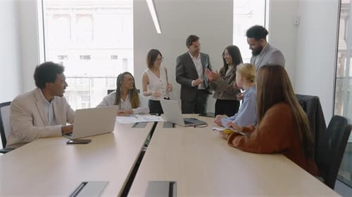 Diverse Team Collaborating and Applauding in a Workplace