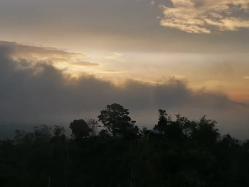 Time lapse of sunset clouds on mountain