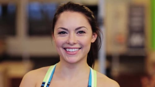 Sport, Fitness, Emotion, Expression And People Concept - Happy Smiling Young Woman At Gym