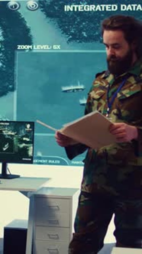 Vertical Video Army Major Reads Operation Details From a Case File in a Control Center
