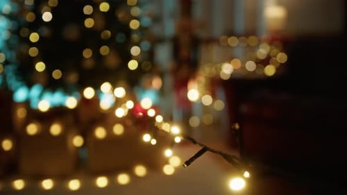 Golden Christmas Lights Twinkling near Christmas Tree