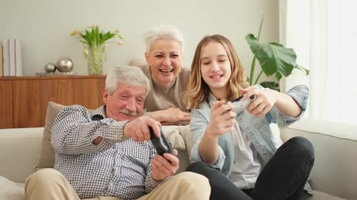 Family Fun: Grandfather, Granddaughter Playing Video Games