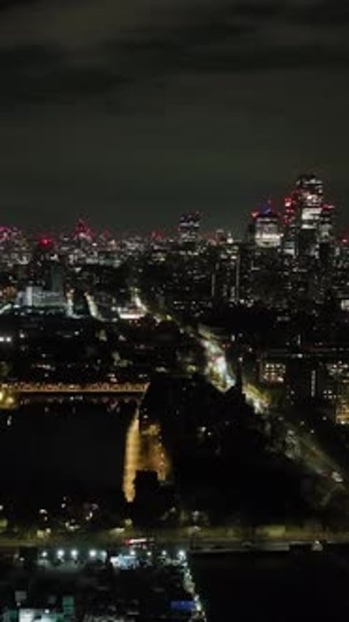 Vertical aerial of traffic in the Shadwell district and the city of London, night