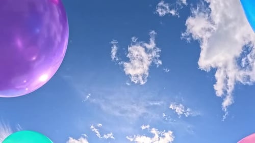 Colorful Balloons Floating Against a Blue Sky Backdrop