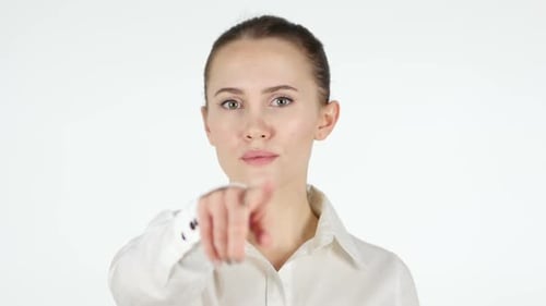 Young Adult Woman Points Directly at Viewer