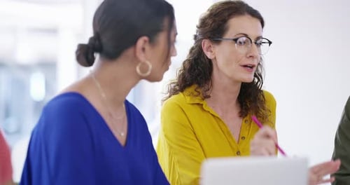 Businesswomen Talking During Meeting at Office Workplace