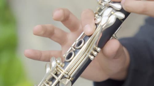 Close Up View of Musician Fingers Playing Clarinet Music Instrument