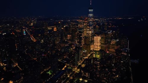 Impressive night scenery of New York. Drone descending above the vibrant city.
