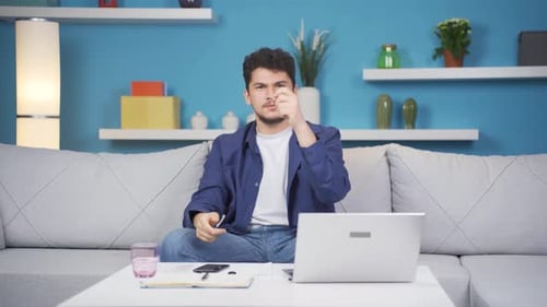 The man looking at the camera with an idea.