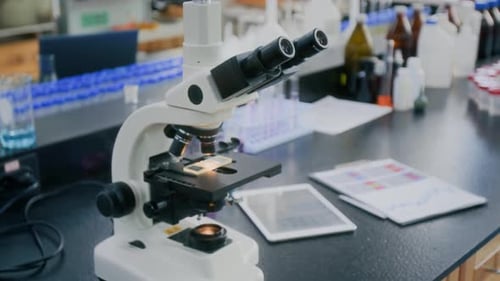 Close-up of Microscope on Work Table in Laboratory