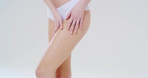 Slow motion close up of woman showing her perfect body, hips and buttocks without cellulite after