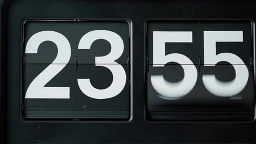 Closeup Retro Flip Clock with White Numbers on Black Background Macro Flipclock