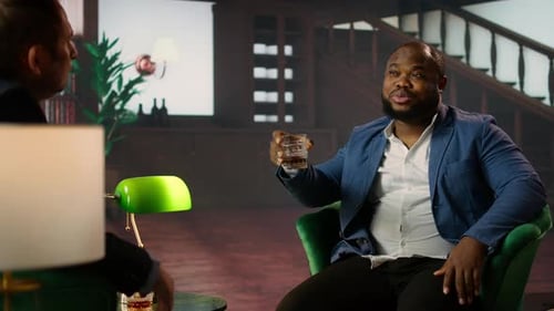 Black Gentleman Serving a Glass of Whiskey Bourbon at the Vintage Social Club