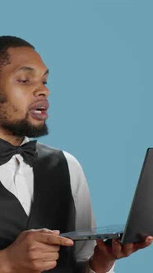 Professional Man on Video Call with Laptop