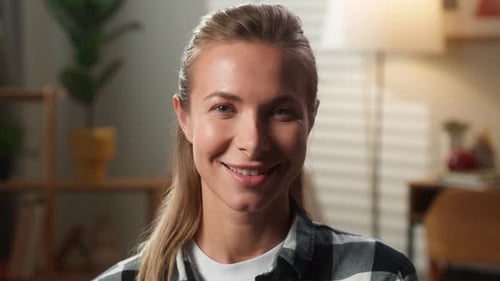 Smiling Woman's Portrait in Cozy Home Setting