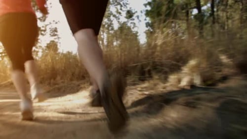 Running Couple on a Trail at Sunrise, Close Up Shoes Steadicam