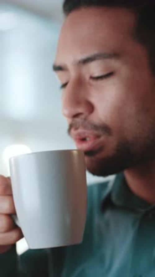 Drinking, business and man with coffee in office for work break, reading email and financial report