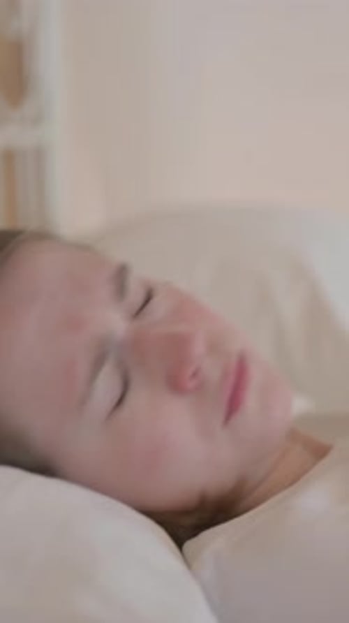 Side View of Shocked Young Woman Waking Up in Nightmare, vertical video