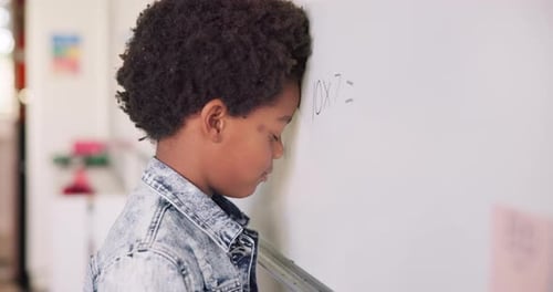 Math class, sad child at board for education, learning and problem solving for skill development
