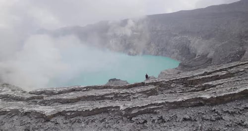 Person on Mount Ijen Volcano Lake in East Java, Indonesia - Aerial