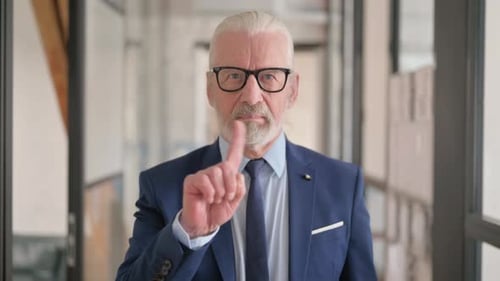 Portrait of Old Businessman in Denial