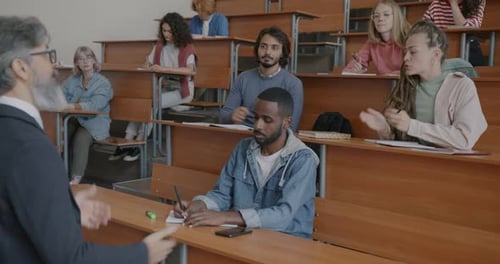 College Students Attending Lecture, Asking Questions
