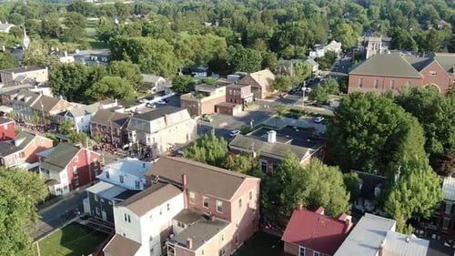 Aerial of Coolest Small Town in America, Independence Day Parade crowds line the streets