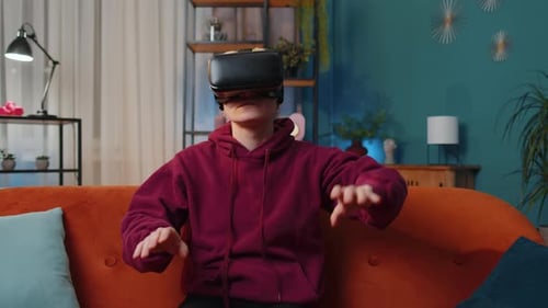 Woman Using VR Headset on Couch