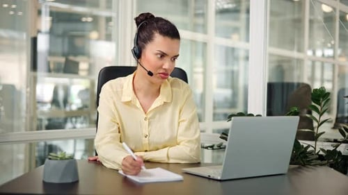 Woman Talking During Video Conference in Modern Office