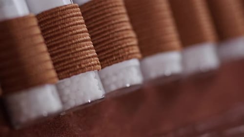 Close up homeopathic globoli glass.