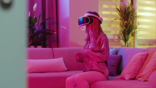 Woman Experiences Virtual Reality on Couch at Home