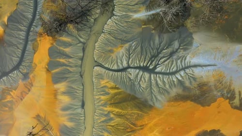 Flying over contaminated mine waters in decanting pond aerial view. Environmental pollution