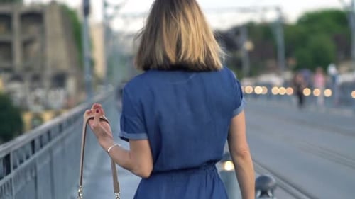 Young Woman Walking Near Street in City, Super 240