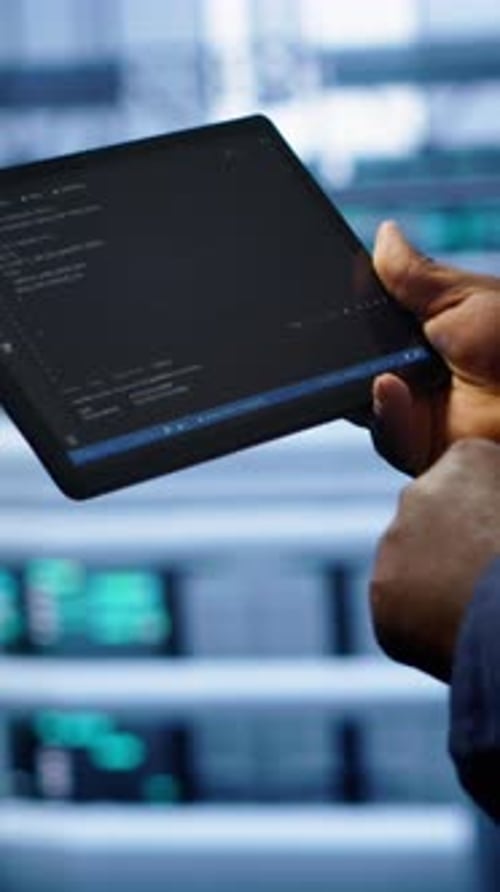 Vertical Video Close Up of Worker Fixing Errors Affecting Servers Performance