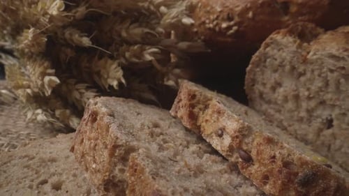 Rustic Bread and Ears of Wheat on the Old Vintage Table Baked Natural Bread ProRes