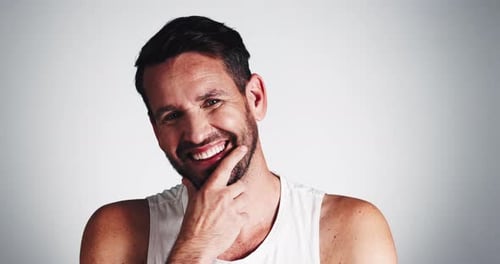 Studio, grooming and man with beard, face and smile for fresh shave, routine and facial treatment