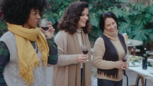 People Enjoying Food and Wine at Outdoor Gathering