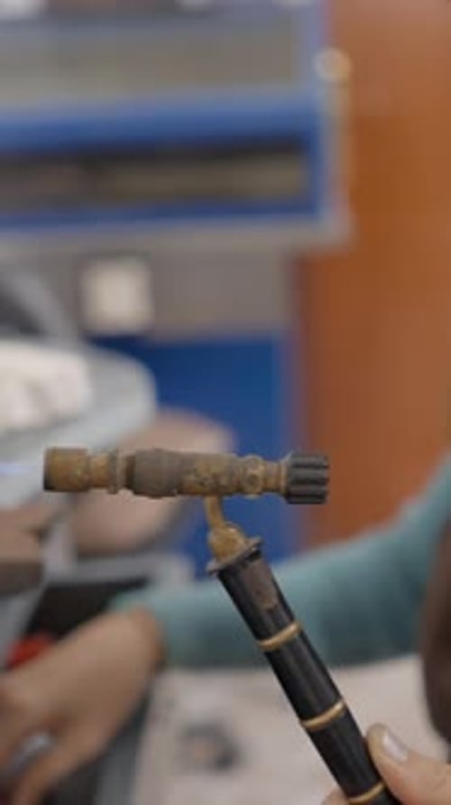 Female Jeweler Holding Gas Blowtorch Crafting In Workshop Close Up Sideview