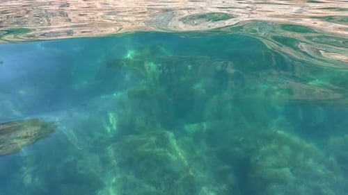 Sea Water Surface Background Low Angle View From Kayak Camera Flies Over the Clear Green Sea Water