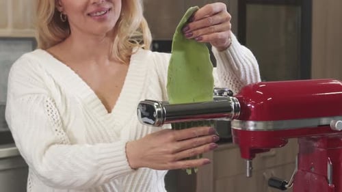 Woman Prepares Pasta with Stand Mixer Attachment