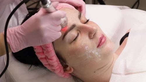 Woman Getting Beauty Treatment With Red Light