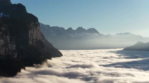 mountain peaks above cloud inversion
