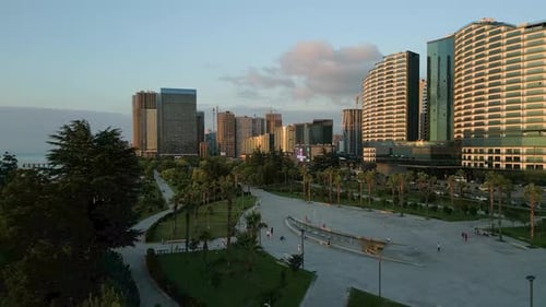 aerial footage over Batumi boulevard during a sunset time